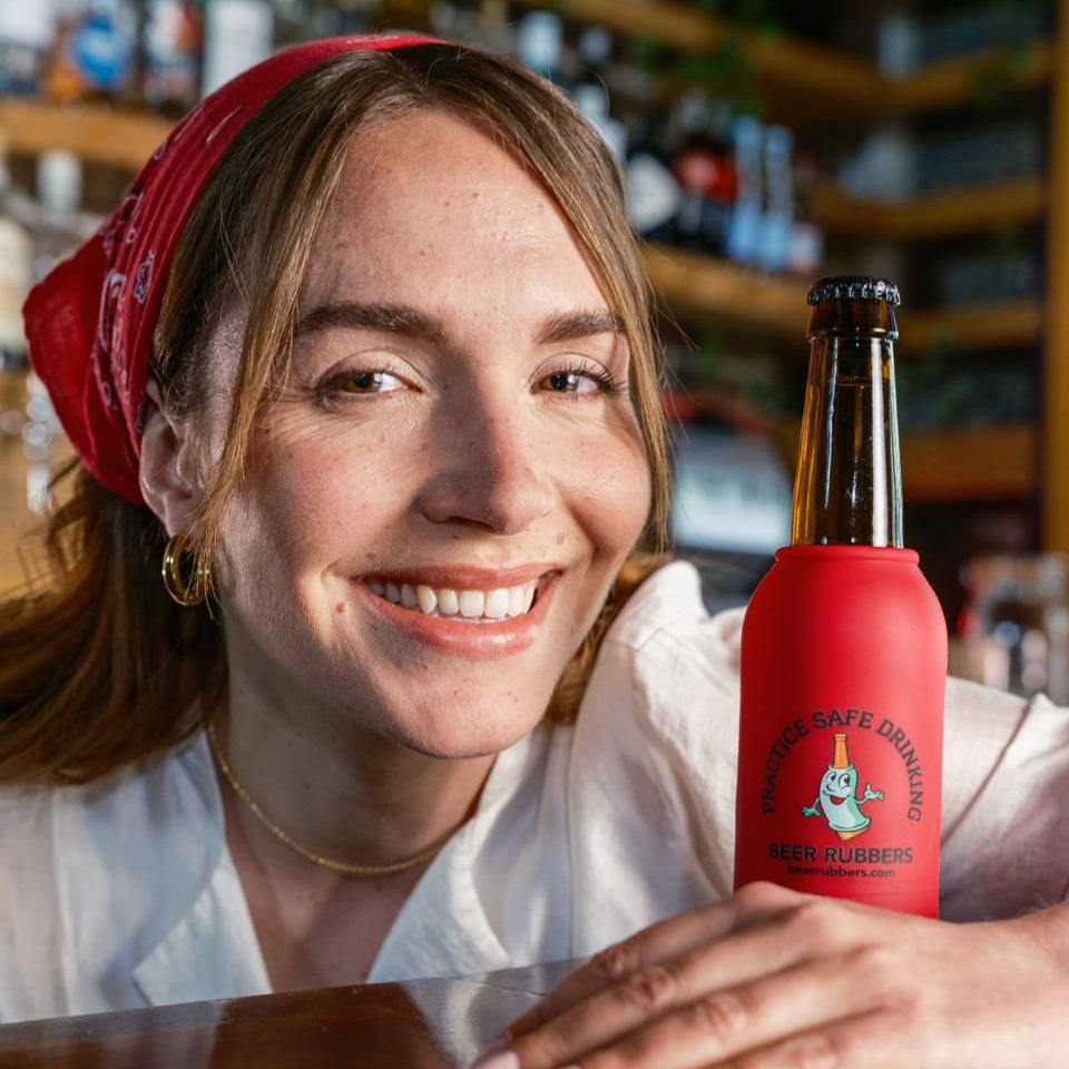 A silicone Beer Rubbers sleeve rolled onto a cold bottle